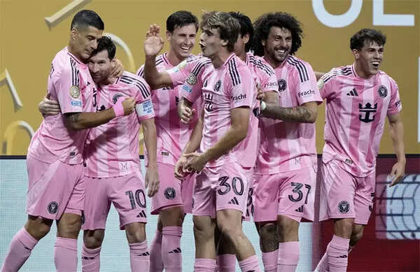 Lionel Messi and Luis Suarez celebrate Miami goal.