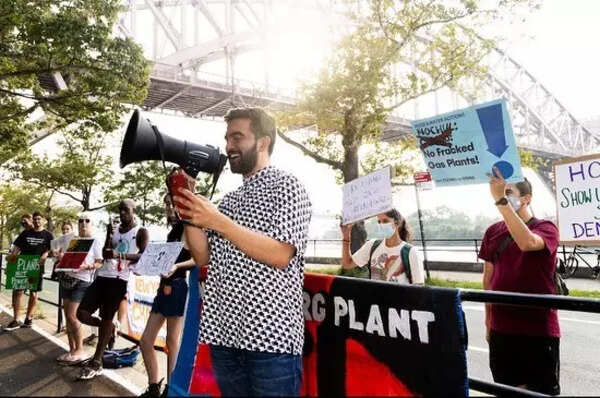 Mamdani advocates against a fracked gas plant in a smart casual outfit.